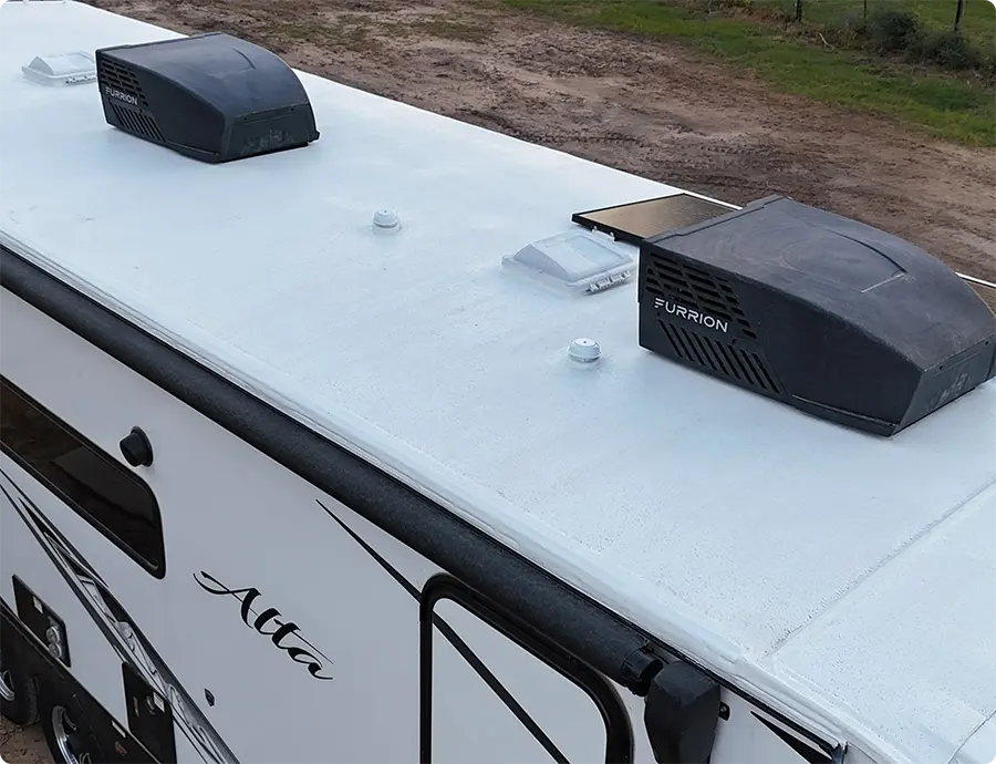 Technician inspecting an RV roof