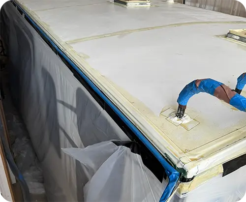 Technician inspecting an RV roof
