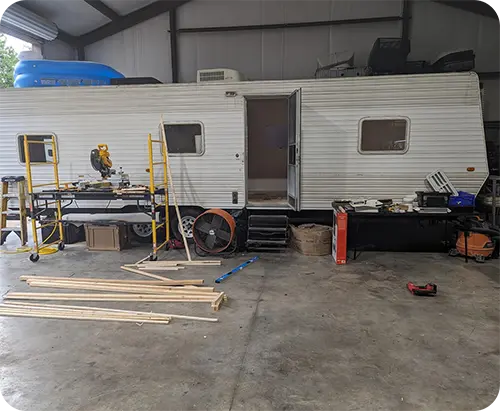 Technician inspecting an RV roof